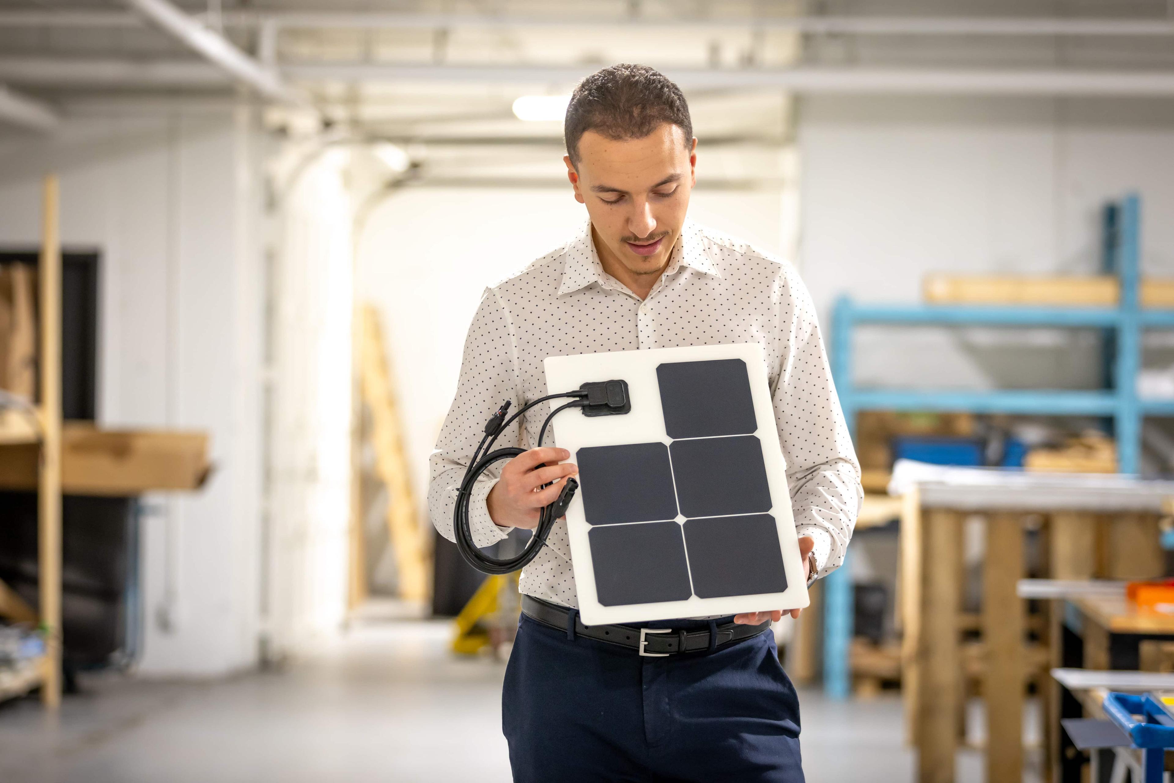 guy holding a solar panel